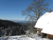 Blick vom Nazishäusle nach Westen am 19.12.2007 übers neblige Rheintal zu den schneebedeckten Vogesen